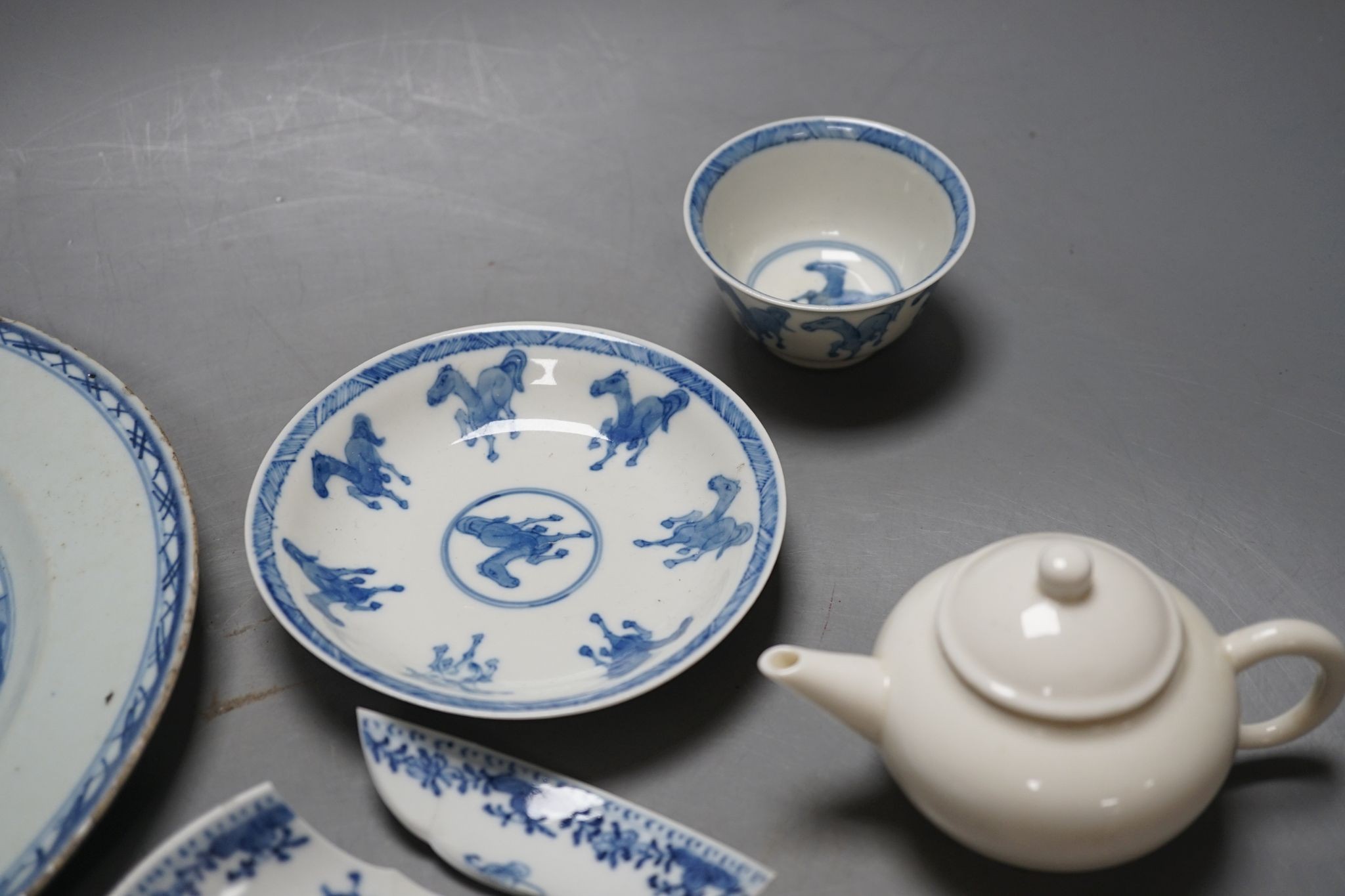 A Chinese blue and white plate, 23.5 cm, a similar tea bowl and saucer, a saucer and a white glaze teapot and cover, 18th century and later